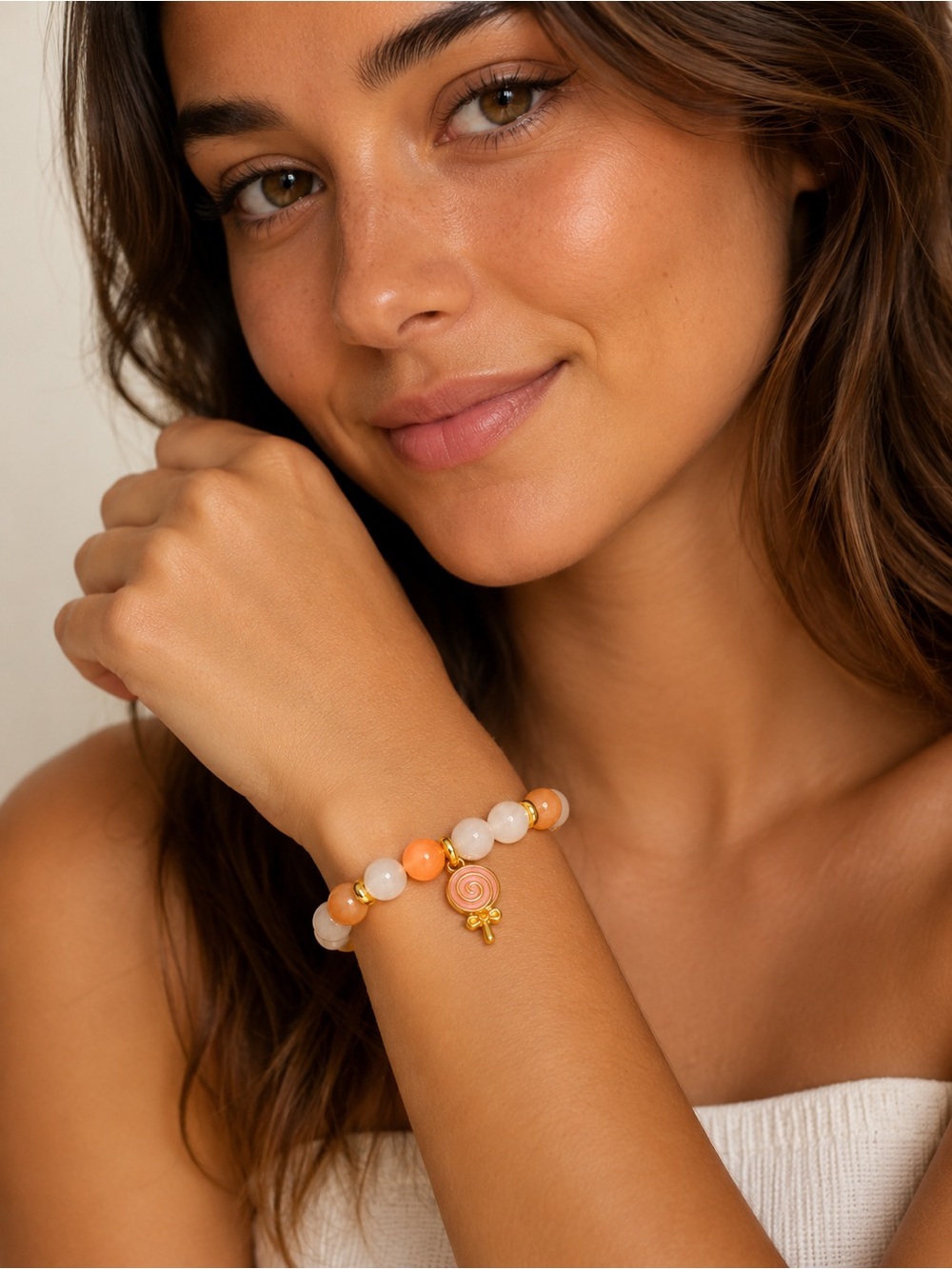Orange and White Handmade Stretchy Beaded Bracelet with Gold Lollypop Charm